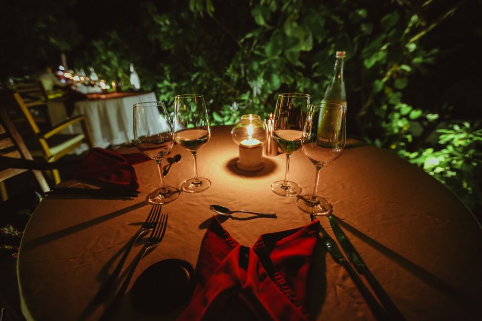 Terrace dining at dusk — candlelit tables overlooking Islamabad's city lights